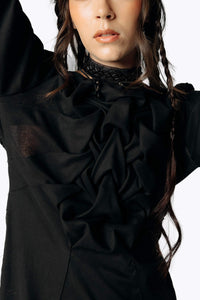 Close-up frontal view of Eliza wearing the Mors Black Cotton Dress with ruffling in the chest from SCATHED's Fall Winter 2025 Reaper collection.