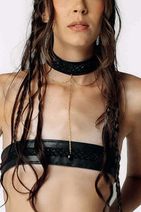 Close-up view of Eliza wearing the Moonfall Choker, and Dicentra Leather Bralette from SCATHED's Fall Winter 2025 Reaper collection.