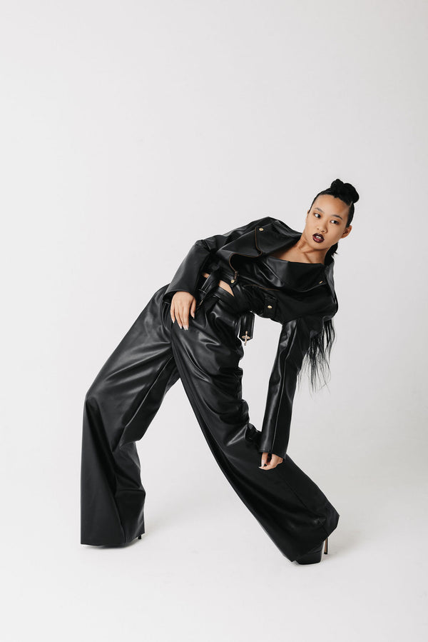 Video of model wearing cactus leather wide leg pants showing front, side, and back view