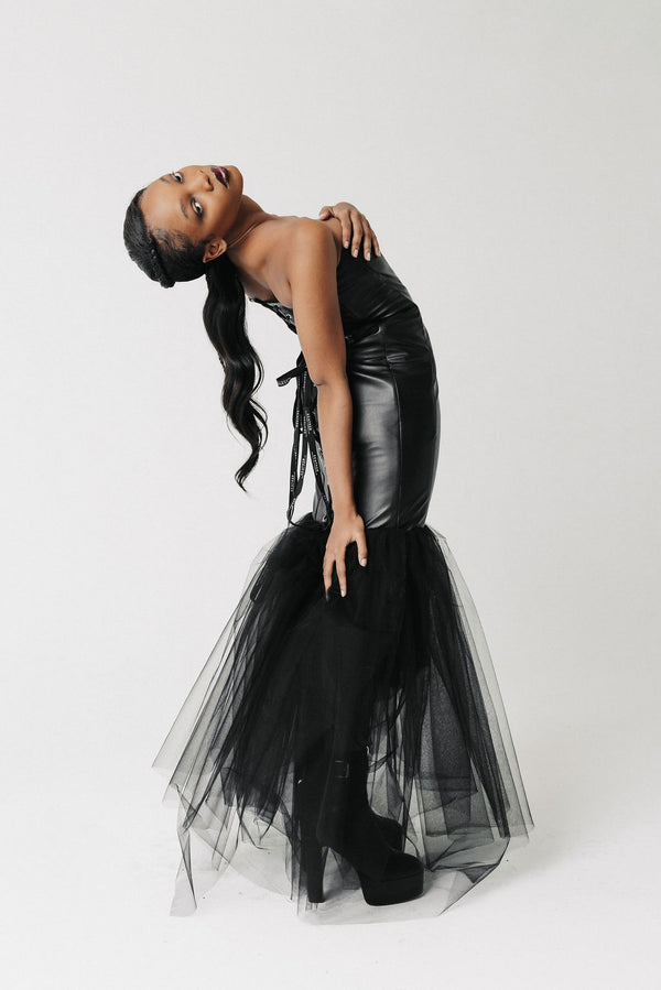 Video of model wearing a cactus leather corset gown with lace up back and tulle skirt. Shows front, back, and side view