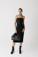 Video with model showing black corset top and the Solace long bamboo cotton pencil skirt. Front, side, and back view