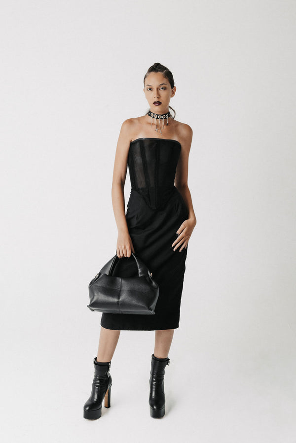 Video with model showing black corset top and the Solace long bamboo cotton pencil skirt. Front, side, and back view