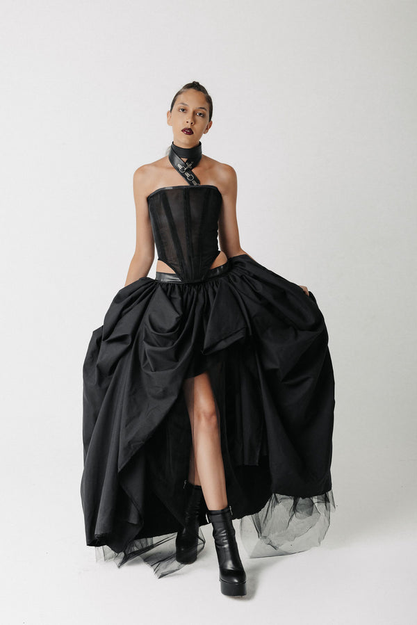 Video of model wearing a black corset top with lace up back and a bamboo cotton midi pencil skirt showing front, side, and back view
