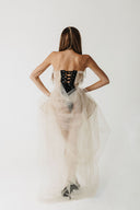 Back view of eco-tulle gown showing exposed black lace-up corset detail