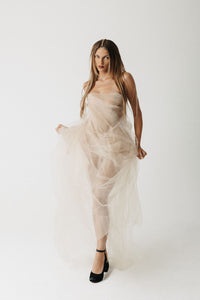 Model wearing strapless nude eco-tulle gown with structured corset, front view