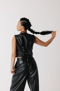 Back view of cactus leather vest showing adjustable lace-up back panel close up
