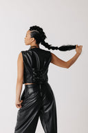 Back view of cactus leather vest showing adjustable lace-up back panel close up