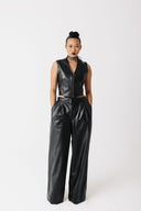 Front view of model wearing cactus leather vest zipped up and wide leg cactus leather pants