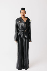 Model wearing cactus leather wide leg pants and cactus leather motorcycle jacket. 