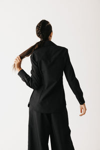  Back view of the Mourner Shirt showing cropped length and fitted silhouette