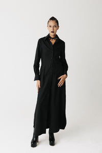 Model wearing the Widow Shirt Dress, a floor-length black button-down shirt dress in organic bamboo cotton
