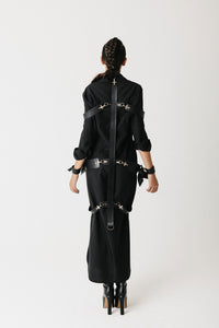 Back view of The Stuart Harness showing the cross-formation strap layout and hook hardware