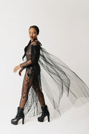 Side view of The Tamar Gown showing the beaded ribbon harness overlay and trailing tulle sleeve