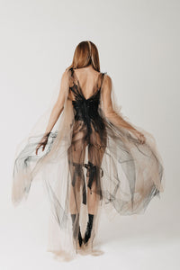 Back view of The Gertrude Gown showing the hand-beaded detail and flowing tulle sleeves