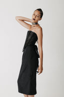 Side view of the Solace Skirt showing its longer hem and back slit