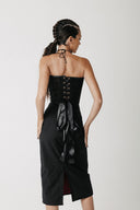 Back view of the Solace Skirt showing its longer hem and back slit