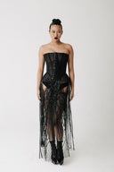 Front view of model wearing the Boudica Gown, a strapless corset dress with hand-beaded fringe cascading down the front