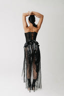 Back view of the Boudica Gown showing the peplum hip detail and beaded fringe train
