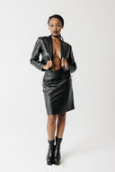 Front view of model wearing the Barbed cactus leather Skirt with a cropped blazer and choker 
