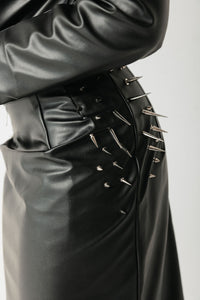 Close-up of the Barbed Skirt showing the metal stud detailing clustered at the hip