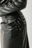 Close-up of the Barbed Skirt showing the metal stud detailing clustered at the hip