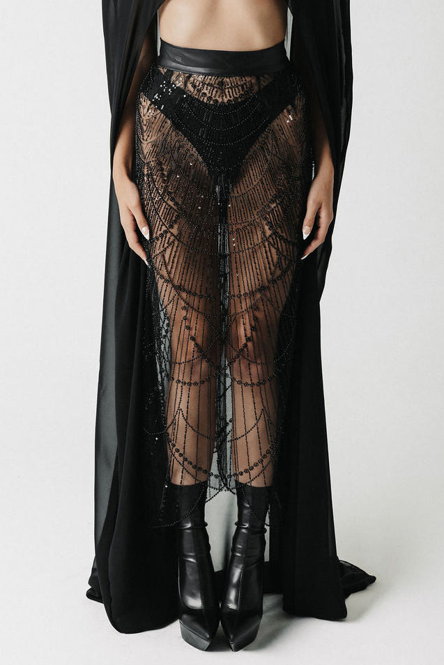Close up of model wearing black sheer beaded skirt with a cactus leather waistband